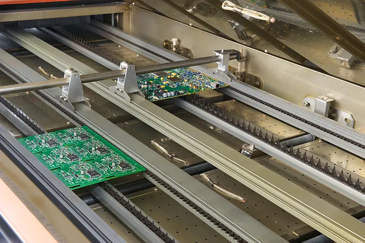 Inside the BTU PYRAMAX 100a reflow soldering oven where you see it setup for dual lane soldering