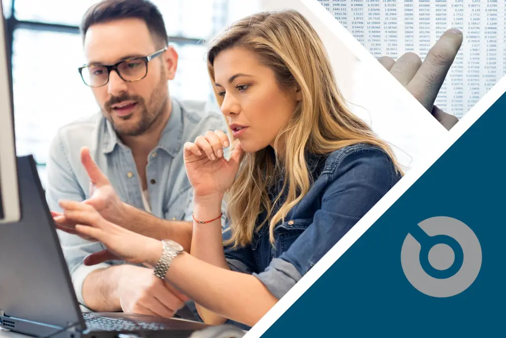 A woman and a man are sitting in font of a PC working with SMT software