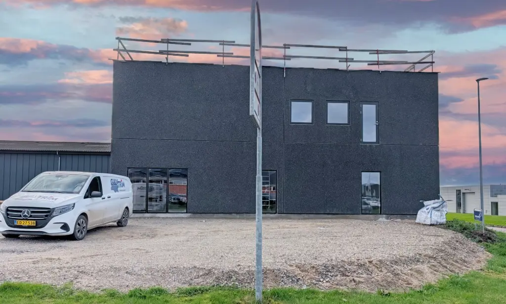 The new CORE-emt headquarters with windows and doors in place, under a beautiful morning sky