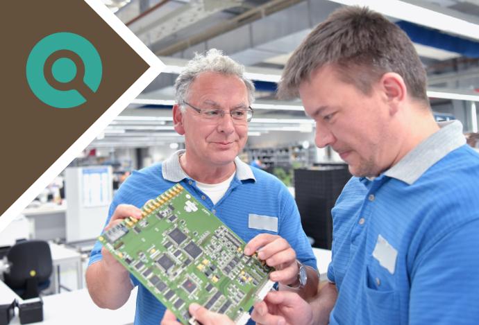 SMT line operators look at pcb after overcoming SMT line bottlenecks