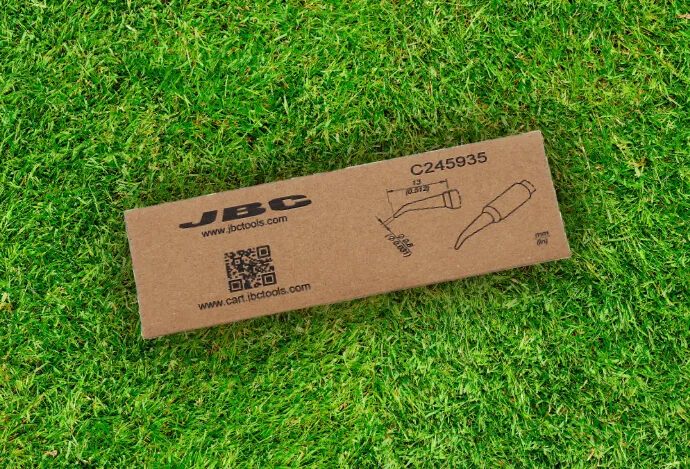 Eco-friendly JBC C245 soldering tip packaging made of recyclable cardboard, shown on a lawn