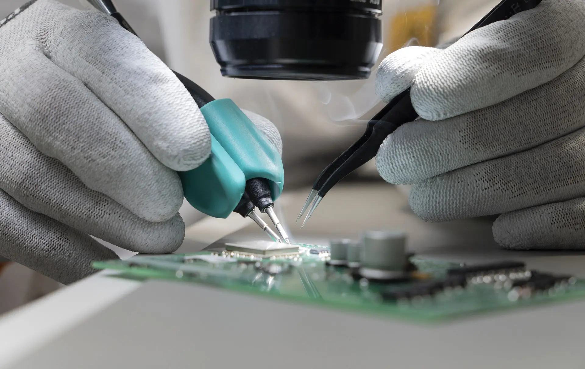 Rework performed on a PCB where a PCB inspection microscope is being used